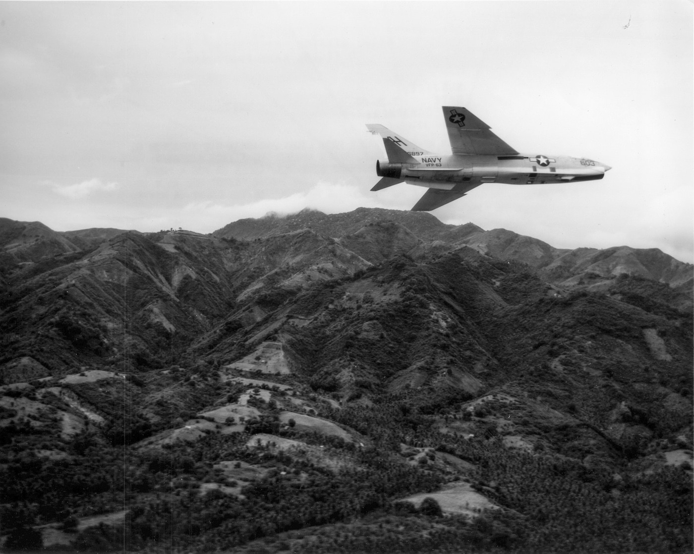 Vought F-8 Crusader - In this photo, a RF-8 Crusader, which was a photo reconnaissance version of the F-8, rolls in to make a photo-reconnaissance run during t...