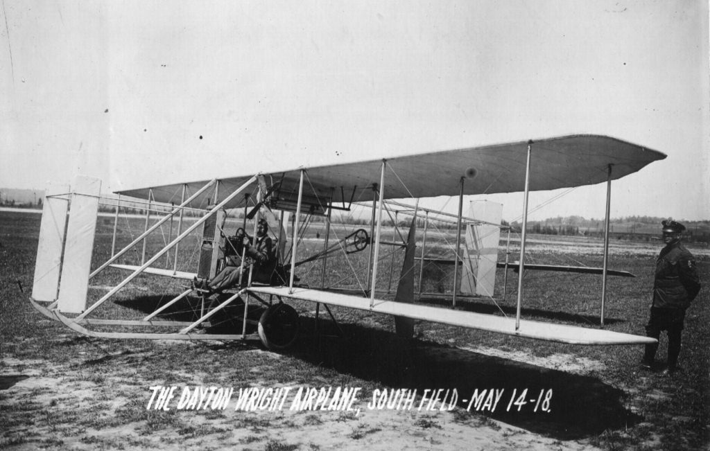 Orville Wright seated in a Wright Model C airplane