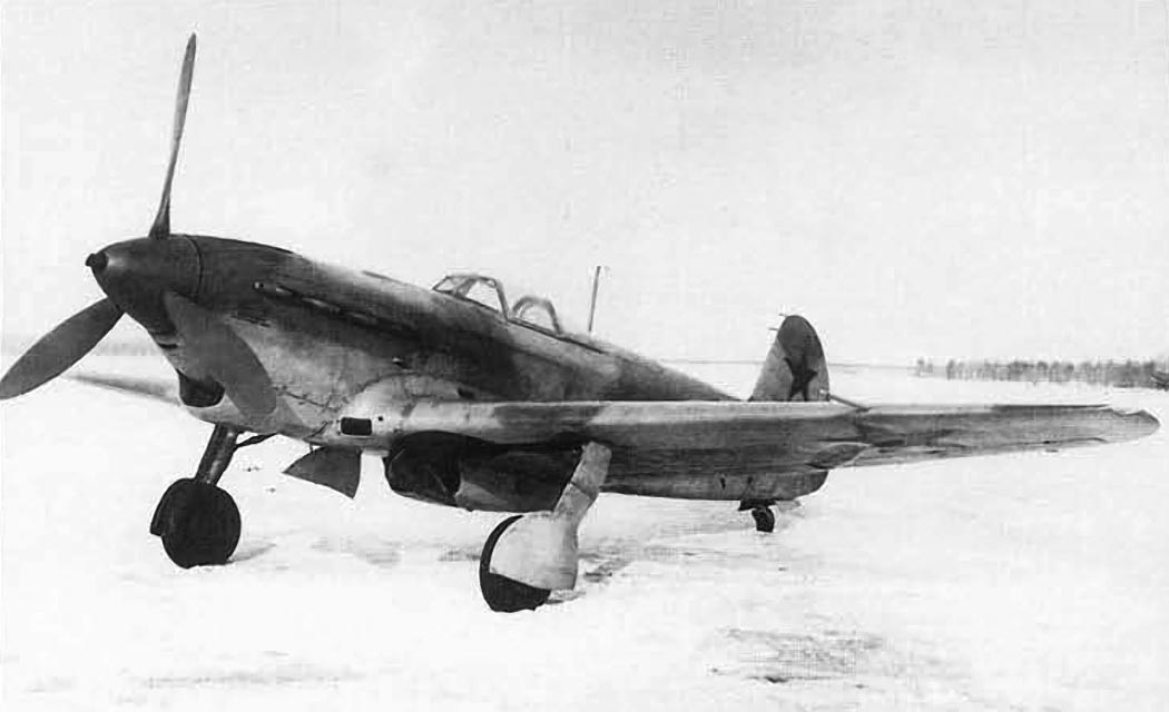 Yakovlev Yak-9 fighter parked on a snowy airfield